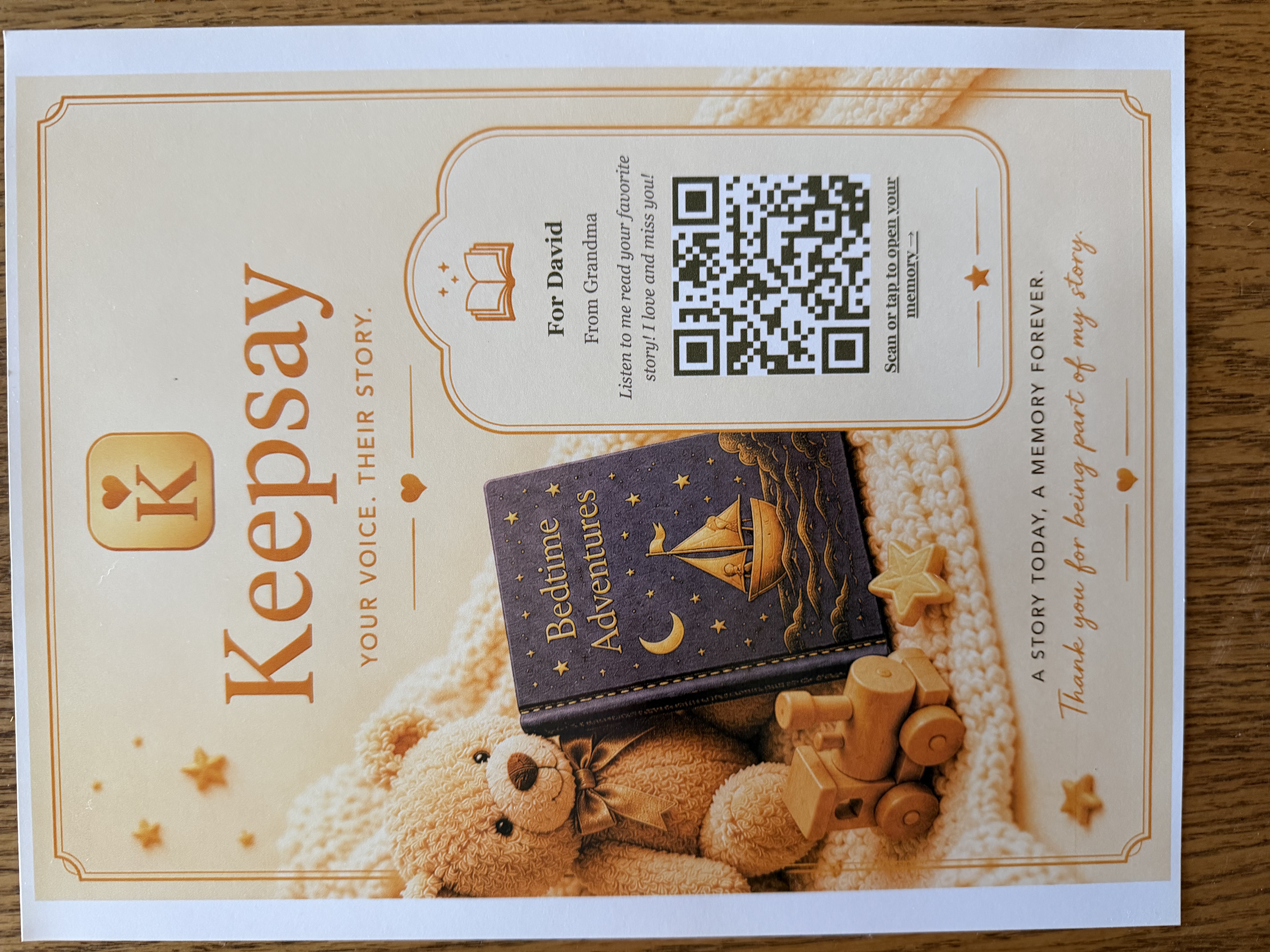 A printed Keepsay Story Card: 'For David, from Grandma — Listen to me read your favorite story' with a QR code to scan or tap.