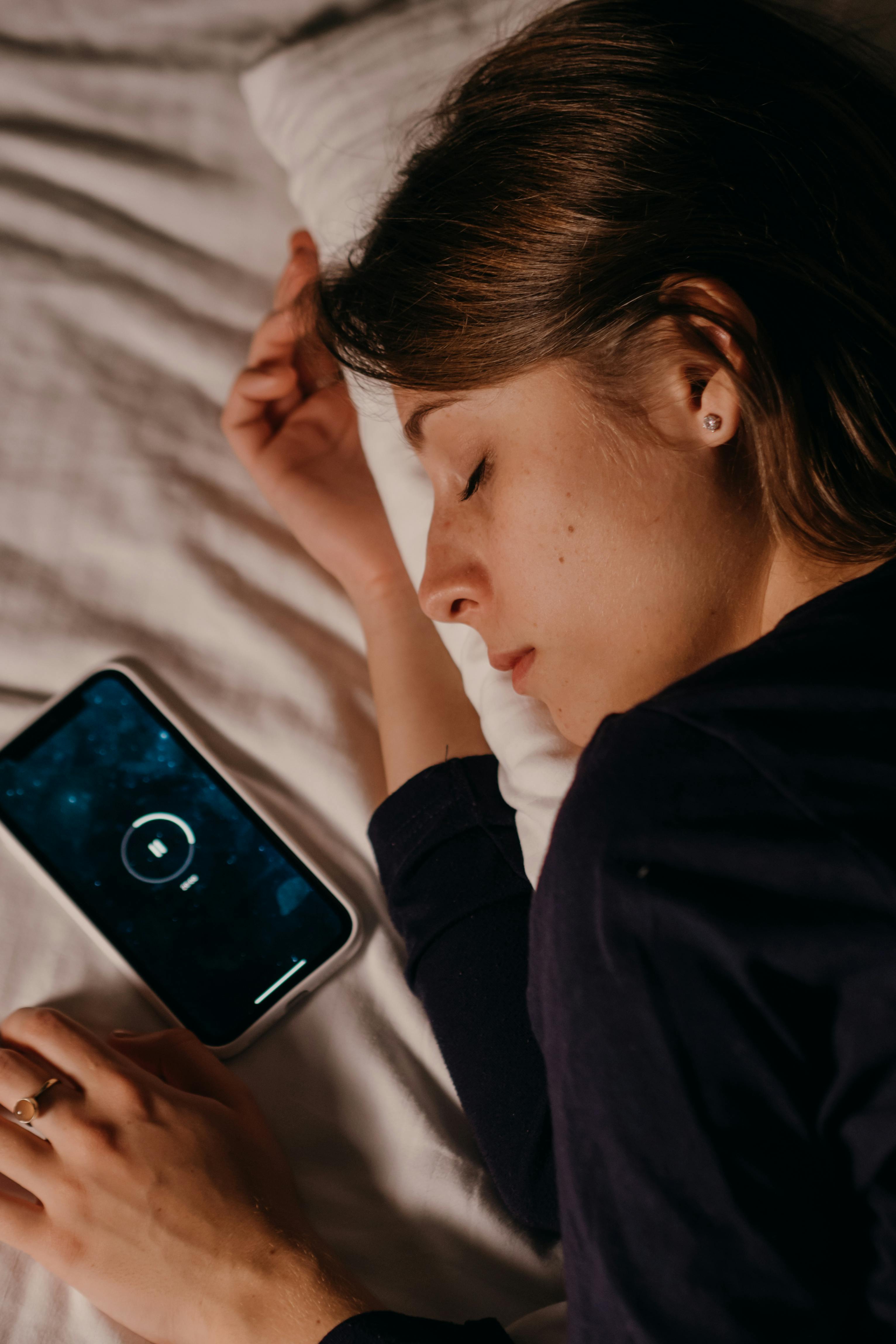 Woman listening to a voice memory on her phone